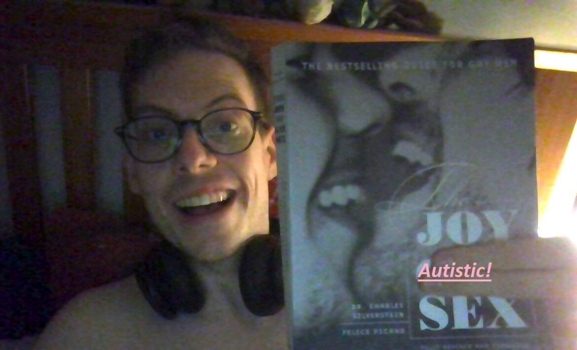 An image with the book cover of Silverstein and Picano's The Joy of Gay Sex, but a shirtless Jorik holds two fingers over the word 'Gay' and, in post, has added 'Autistic' to it.