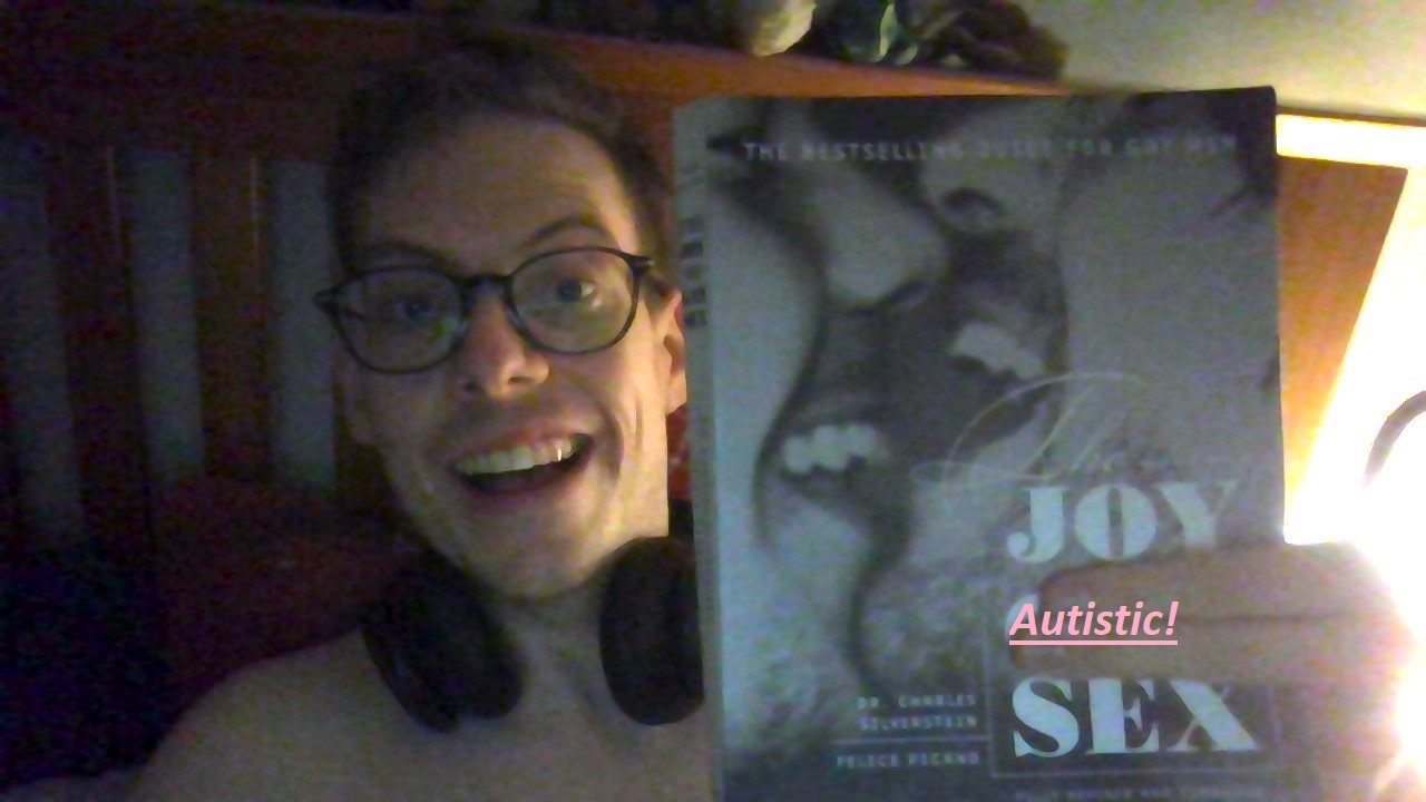 An image with the book cover of Silverstein and Picano's The Joy of Gay Sex, but a shirtless Jorik holds two fingers over the word 'Gay' and, in post, has added 'Autistic' to it.